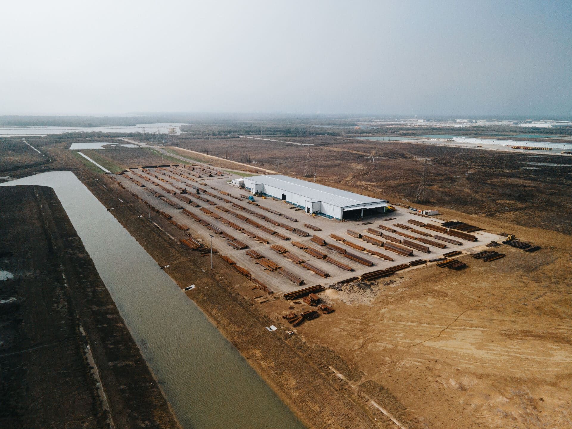 Wide aerial view of the Brown Strauss Houston facility and surrounding site