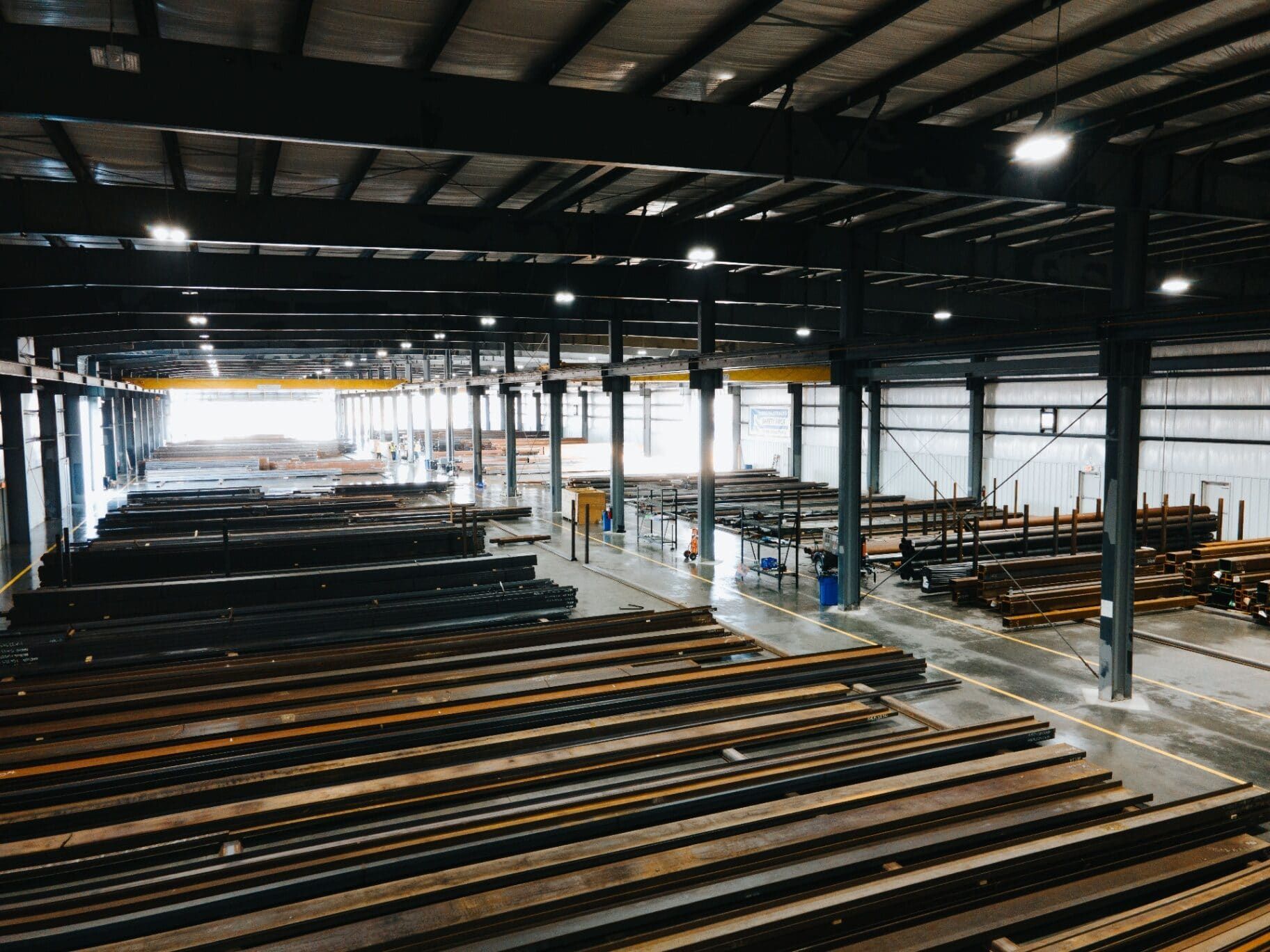 Interior of the Brown Strauss Houston warehouse with stacked steel