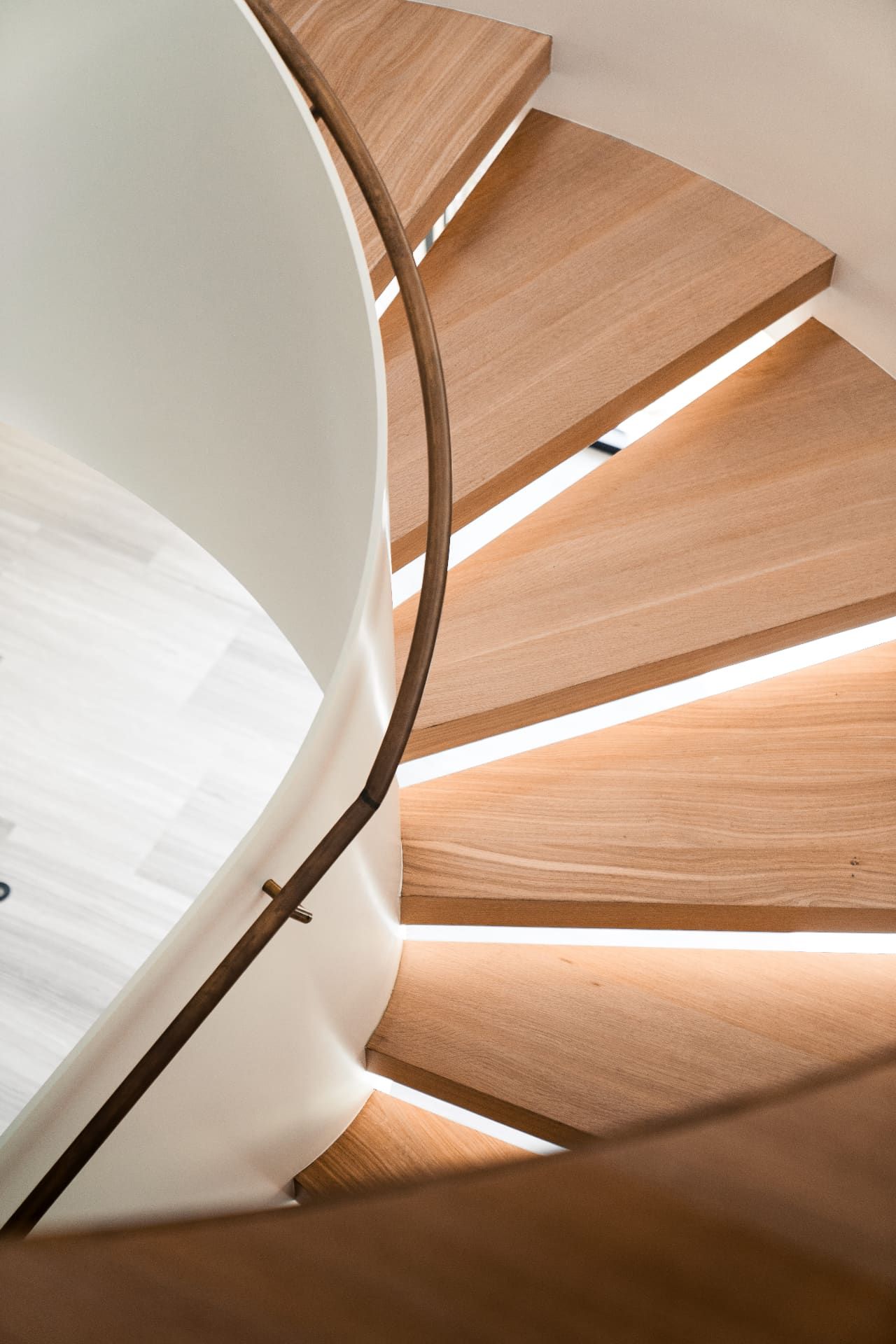 Spiral staircase wood treads with LED detail