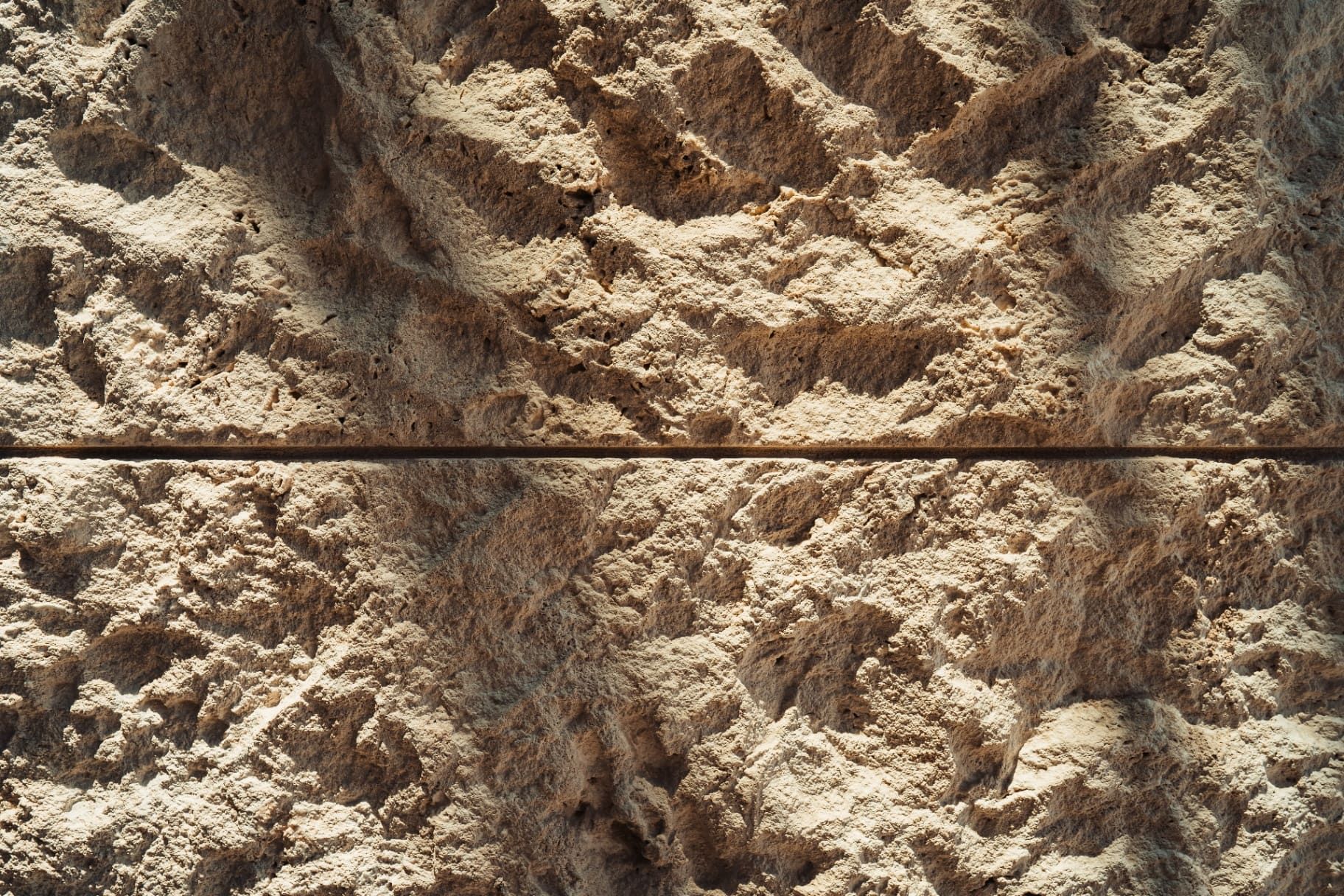 Split-face limestone texture closeup